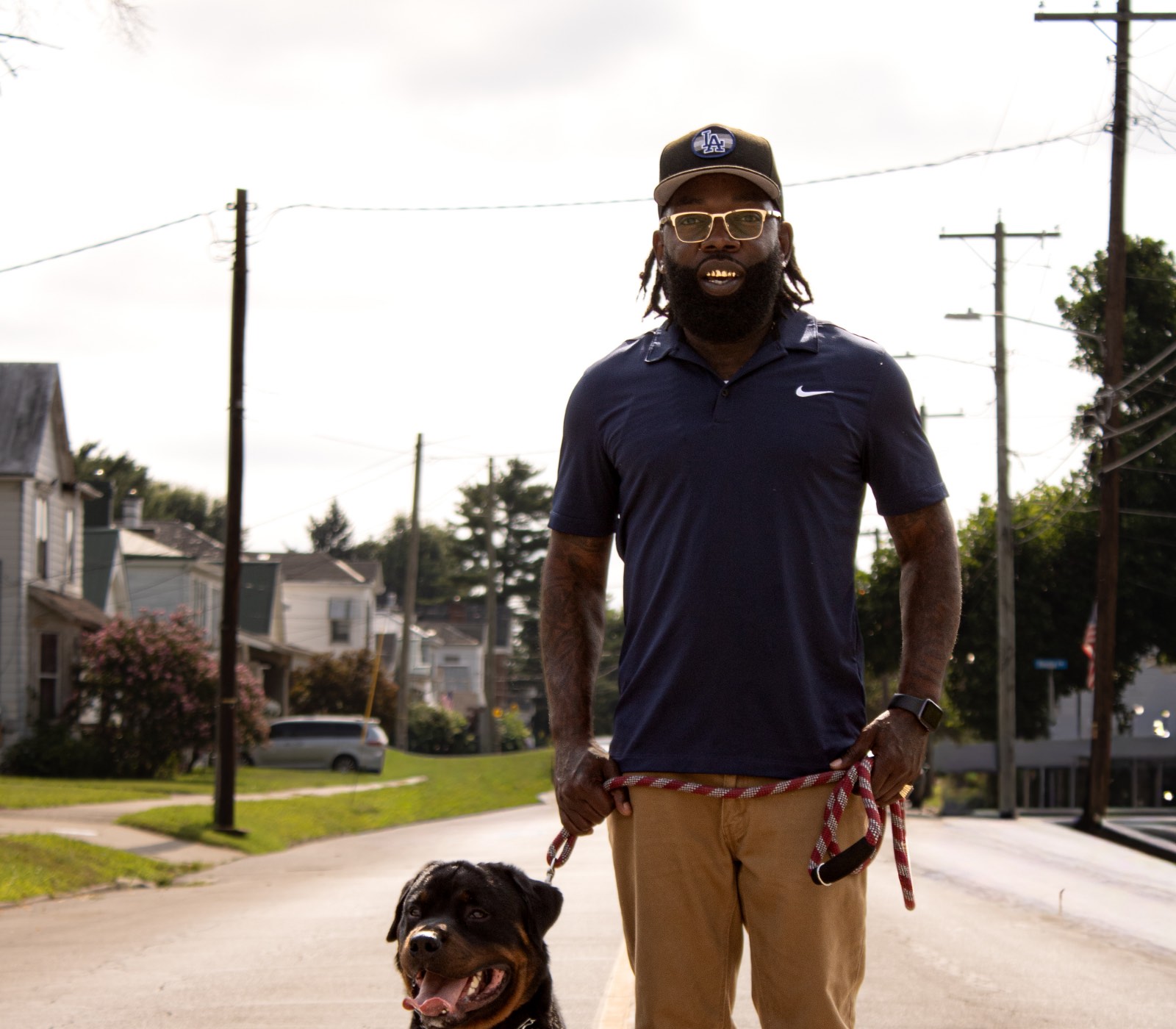 LaRon Washington walking his dog on a Maysville neighborhood street